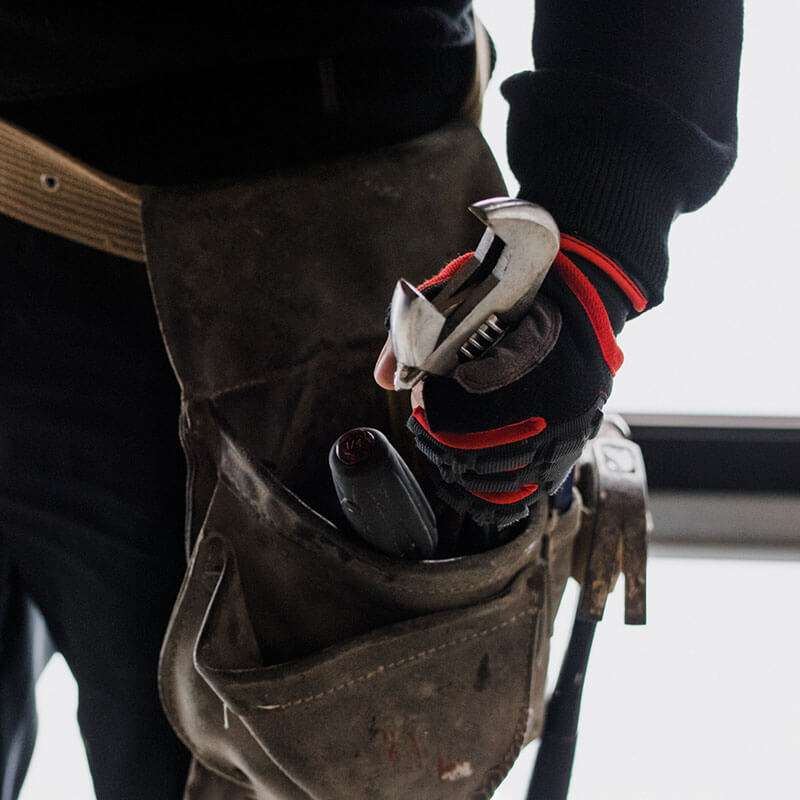 Plumber with a tool belt ready for the job