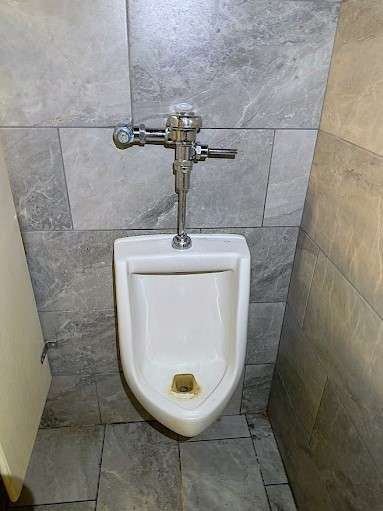 Commercial urinal with Sloan flush valve