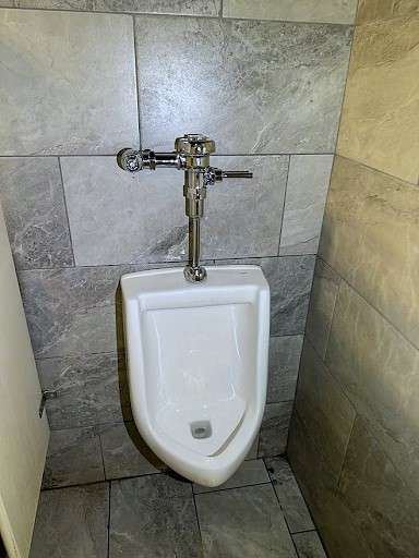 Urinal and flush valve after service